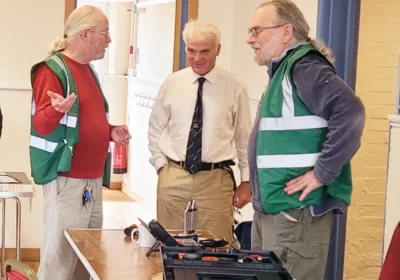 Fordingbridge Repair Café project lead Dave Sanders, left, with MP Sir Desmond Swayne, centre, and repairer Steve Tonkin
