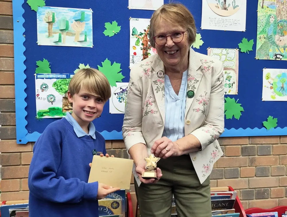 Winner Wilbur with chair of Planet Wimborne, Linda Bunting