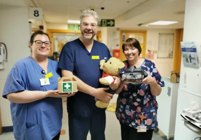 Allysha Pell, trainee play specialist (left) and Debbie Daniels, play specialist, with children's unit staff nurse Kev O'Brien, are keen to meet as many children – and their soft toys - as possible at the teddy bear clinics