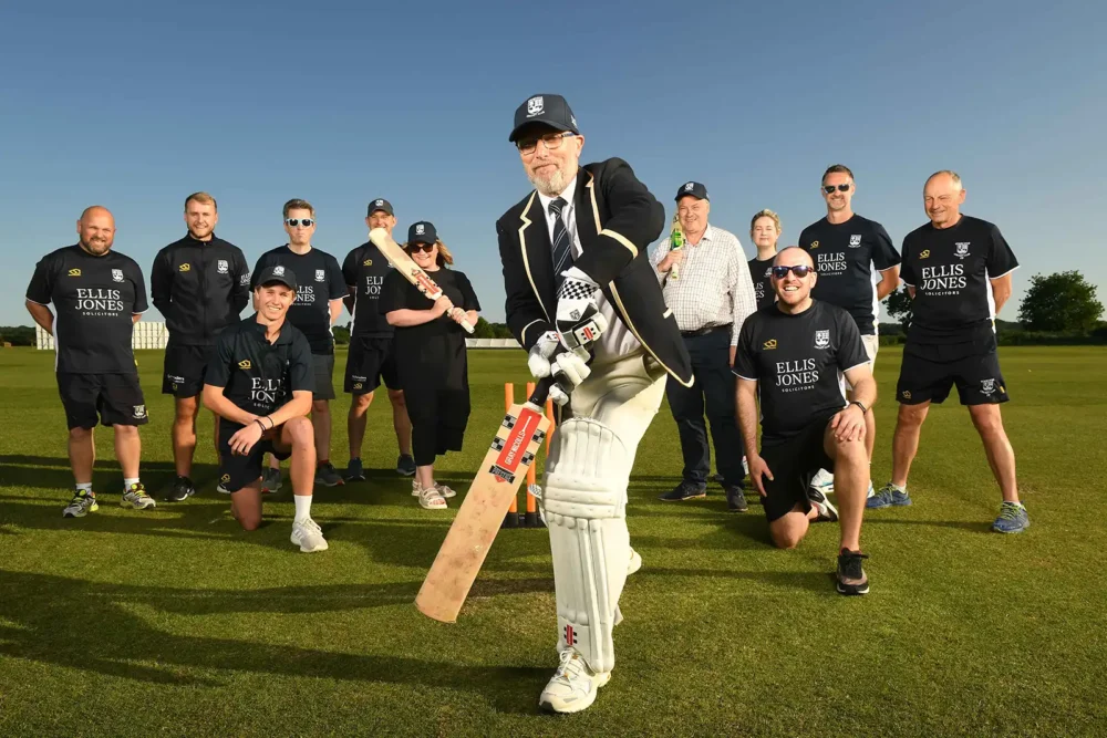 Pictured with club players, front centre, are, from Ellis Jones, employment/HR lawyer Kate Brooks, consultant solicitor (residential conveyancing) Paul Dyer, batting, and private client advisor Andy Kirby