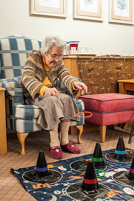 Brook View resident Barbara Phillips plays Witch Ring Toss