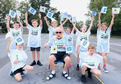 Eric Cole with youngsters who took part in his campaign