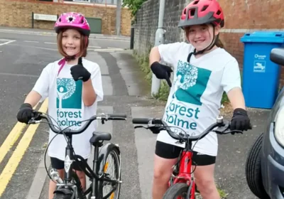 Macy and Pippa get on their bikes for Forest Holme Hospice Charity