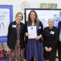 Lara Longford, learning & community engagement officer, and two members of her volunteering team being presented with the award