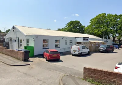 The man, in his 60s, was found outside Upton Social Club, in Poole Road. Picture: Google