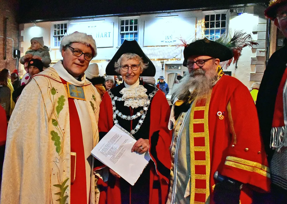 The Rev Canon Andrew Rowland, Rector at Wimborne Minster, left, with mayor Diann March and town crier, Chris Brown. Picture: Tom Scrase