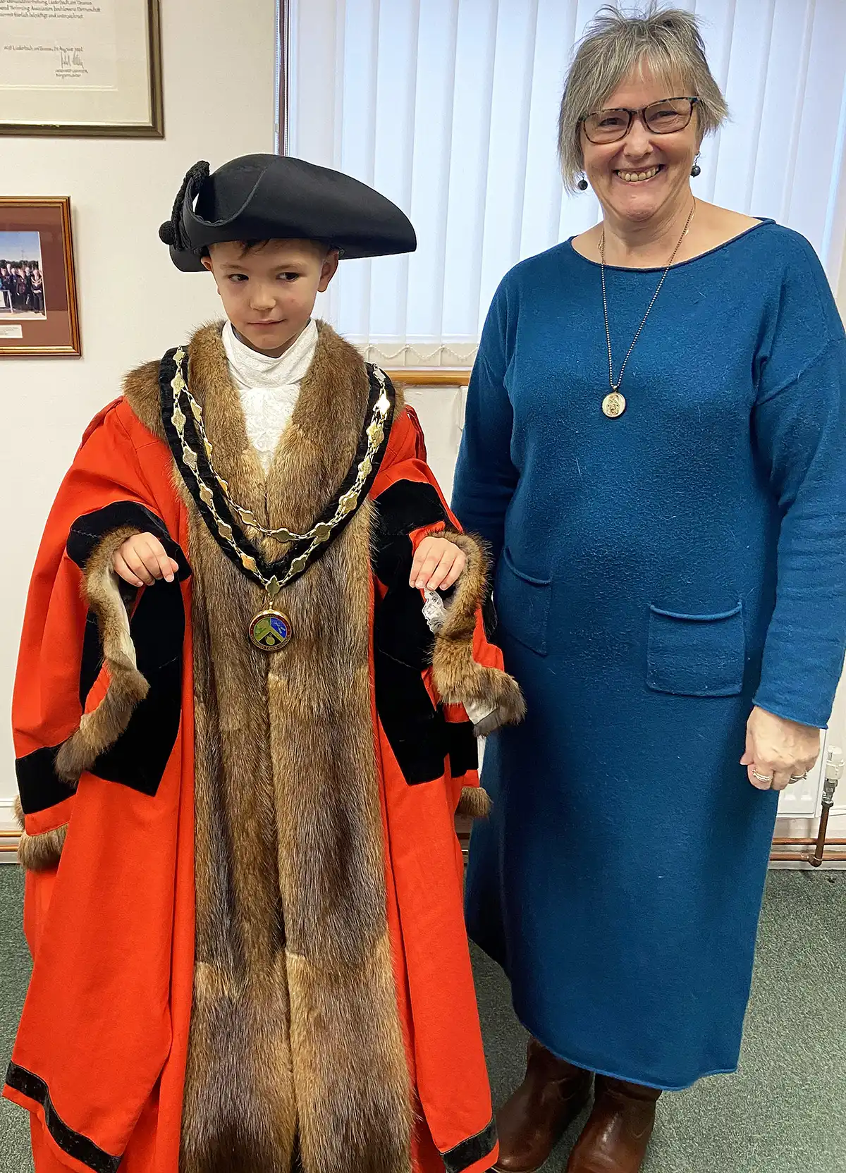 Tommy Lawes tries on the mayoral robes for size