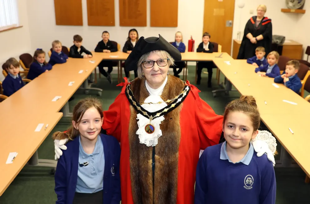 Mayor of Verwood, Cllr Toni Coombs, with Jasper Nash, chair of the school parliament, right, and Sienna Mills, deputy prime minister