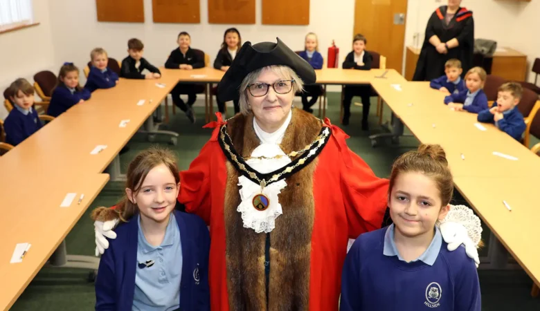 Mayor of Verwood, Cllr Toni Coombs, with Jasper Nash, chair of the school parliament, right, and Sienna Mills, deputy prime minister