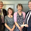 Wimborne Rotary President, Graham West, Sally Way and Susan Ridd from Poole and Bournemouth Read Easy, and Rotarian Brian Dryden