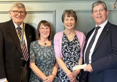 Wimborne Rotary President, Graham West, Sally Way and Susan Ridd from Poole and Bournemouth Read Easy, and Rotarian Brian Dryden