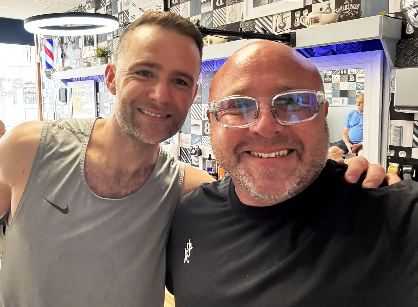 McFly drummer with Andy Pritchett at Barnet's Barber Shop in Wareham.  Image: Barnet's Barber Shop