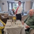 Margot and Conrad enjoying their anniversary meal at the care home Picture: Barchester Healthcare