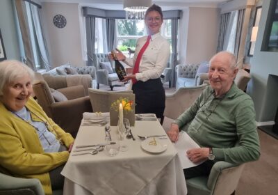 Margot and Conrad enjoying their anniversary meal at the care home Picture: Barchester Healthcare