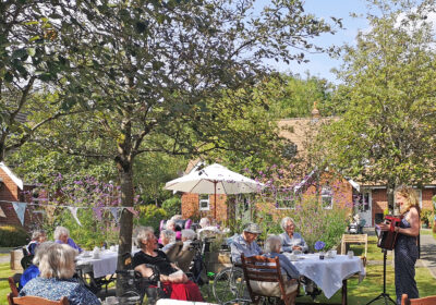 Accordionist Debbie Murphy entertains residents and visitors on the first of Brook View’s two open afternoons under the National Garden Scheme Picture: Colten Care