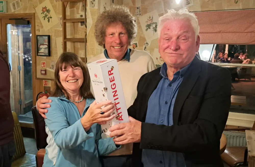 Viv and Dave Arkell receiving their Champagne prize from Wimborne mayor, Cllr Jeff Hart