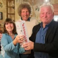 Viv and Dave Arkell receiving their Champagne prize from Wimborne mayor, Cllr Jeff Hart