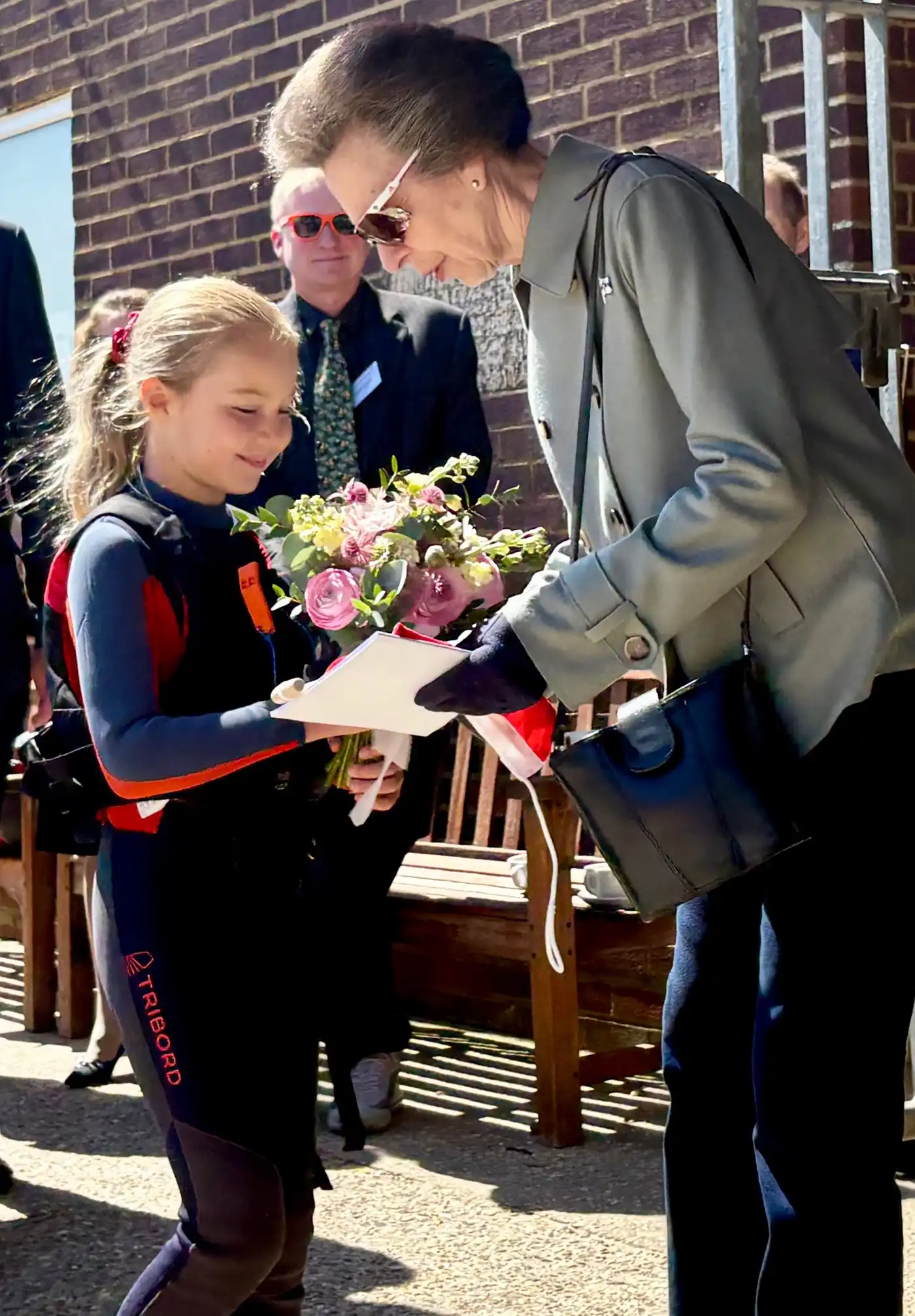 The Princess Royal receives a bouquet from Pirate sailor, Tabitha Wheeler