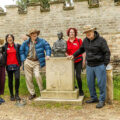 Bill Watts, far right, by the Baden Powell statue on Brownsea Island in Poole Bay. With him, from left, are: fellow resident Jeanette Macklin, companion Melissa Siat, resident Tony Husband and companion Pauline Gauden Picture: Colten Care
