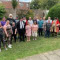 Royal Navy veteran Steve Jenkin and members of the Millstream Theatre, one of the mayor’s charities for 2025/26, joined in with the celebrations Picture: Wimborne Minster Town Council