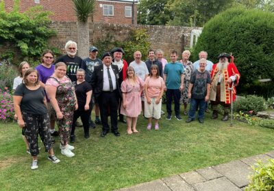 Royal Navy veteran Steve Jenkin and members of the Millstream Theatre, one of the mayor’s charities for 2025/26, joined in with the celebrations Picture: Wimborne Minster Town Council