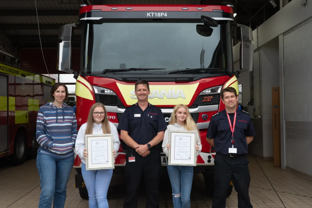 Sheridan and Kayleigh receiving their awards Picture: DWFRS