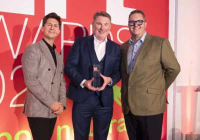 Matt Renaut managing director of Dacombes of Wimborne (centre) picking up one of his two ERT awards Picture: Dacombes of Wimborne