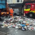 The bin lorry emptied contents in the centre of Wimborne. Pictures: Dorset Council