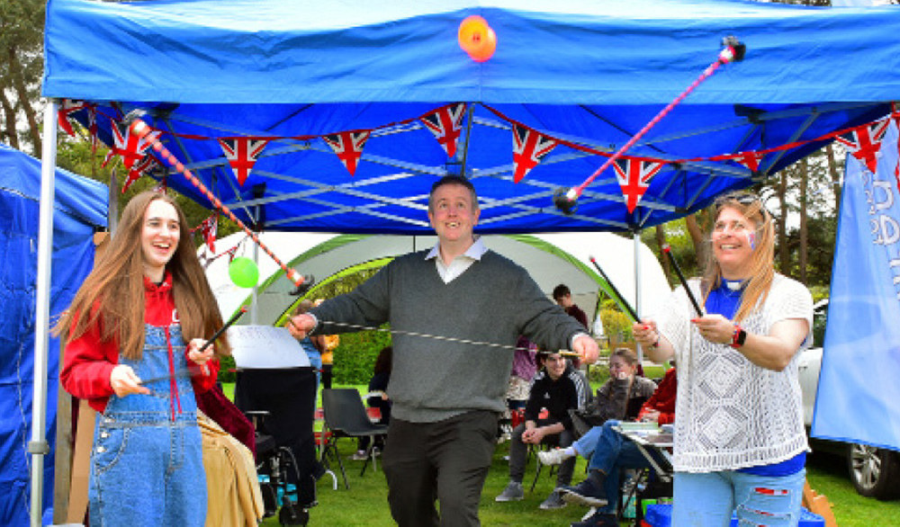 l A rousing mass march past, featuring impeccably-turned-out regimental bands and Scouts, added a sense of royal occasion to Ferndown’s Coronation Big Lunch Party on King George playing fields on Sunday, May 7.