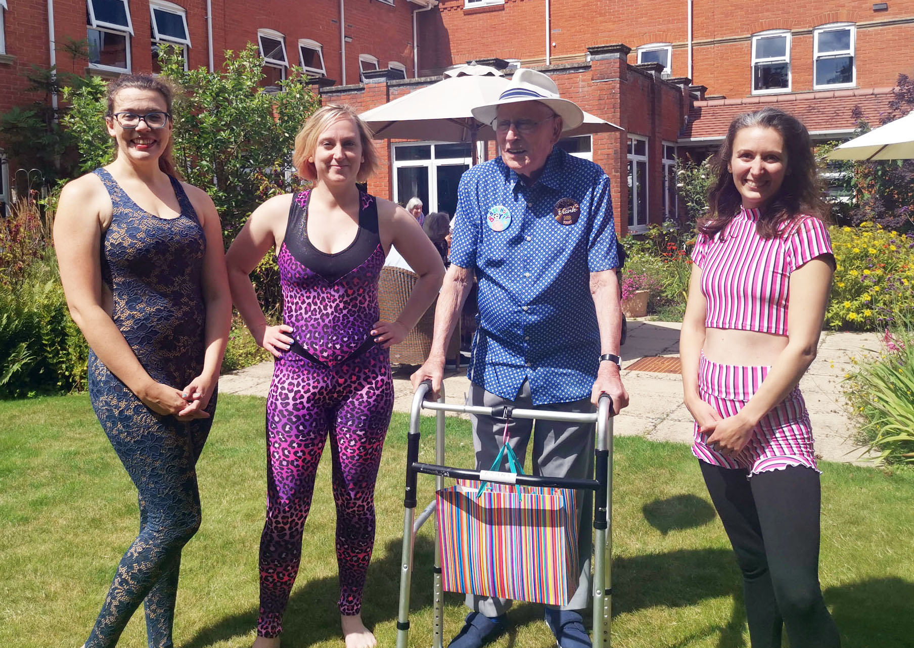 100-year-old Frank on his birthday at Canford Chase in Poolewith Secret Circus performers, from left; Jennifer Durrett, Sarah Philips and Chloe Bradwell