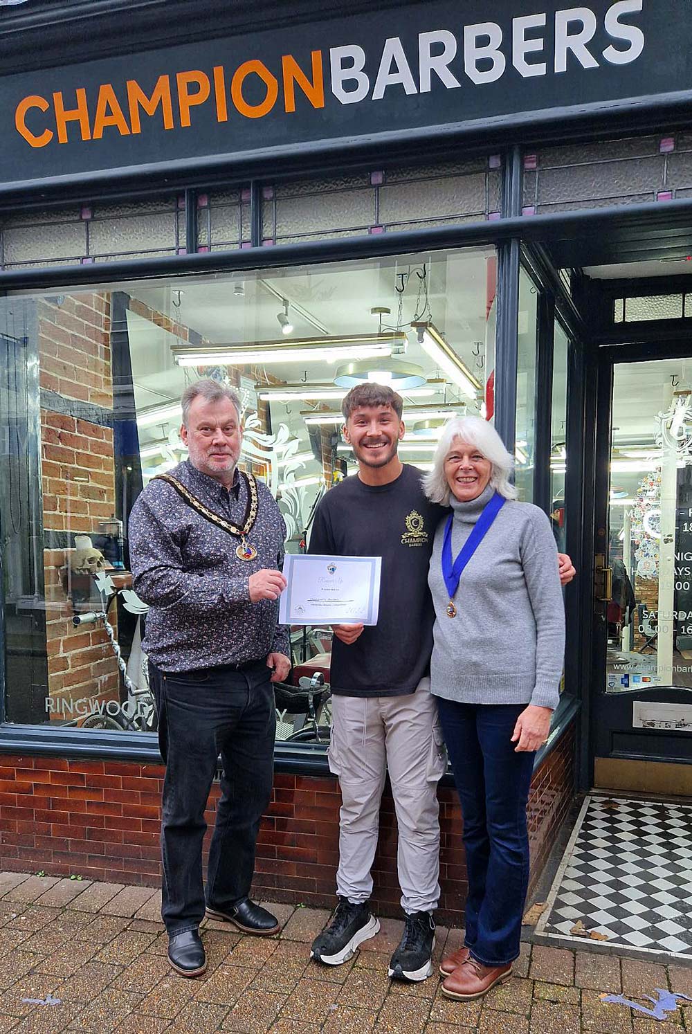 CHRISTMAS CRACKERS: Ringwood mayor Gareth DeBoos with winners Champions Barbers