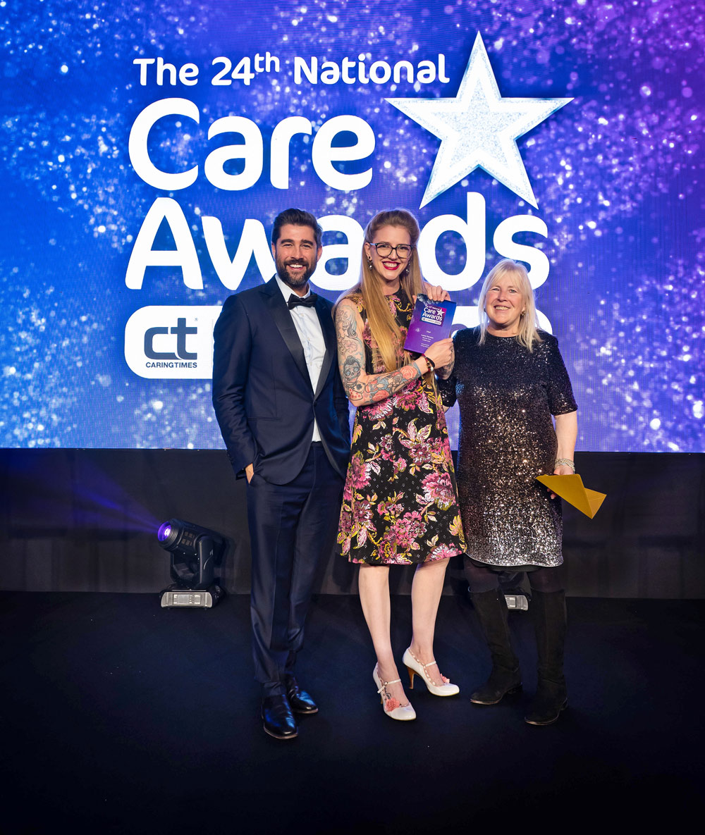 Lorna Parsons receives her Chef of the Year award from ITV presenter Matt Johnson and Jo Wildman, director of compliance, governance and quality for Caring Homes.