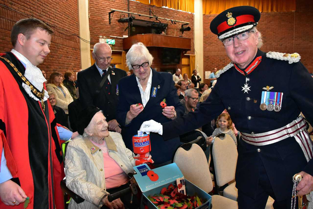 Lord Lieutenant Angus Campbell making a donation, watched by the Mayor of Ferndown Lawrence Wilson. Pictures: Tom Scrase
