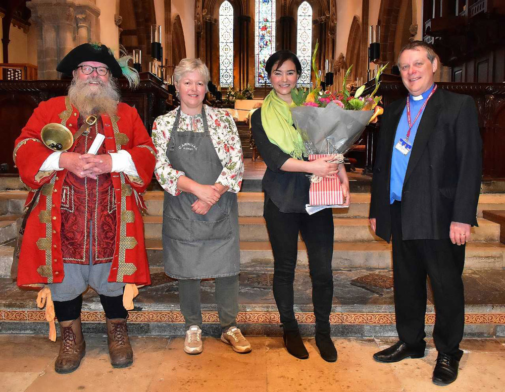 Town Crier Chris Brown, Sharon from Carnival Flowers, TV Star Sonnaz Nooranvary and Rev. Photo by Tom Scrase