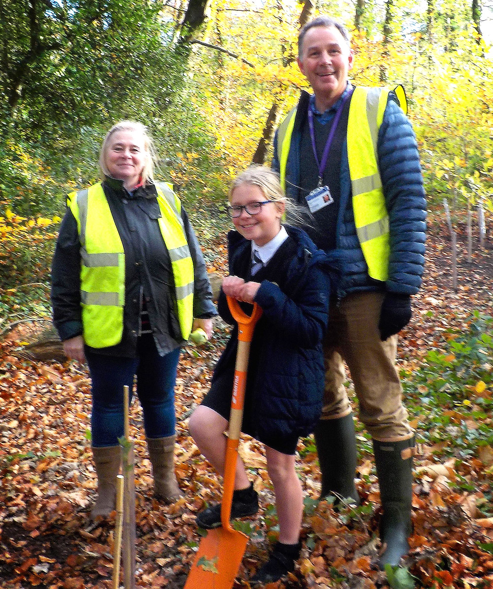 Parish chairman Emma Urquhart, headteacher Ron Jenkinson, and the youngest pupil at the school Lily Launder